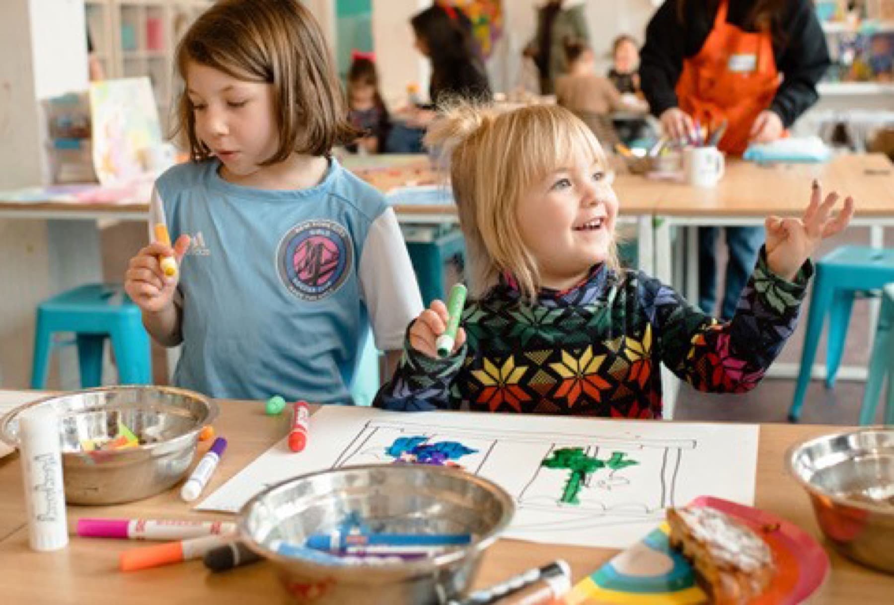 Two children drawing at PLAYDAY